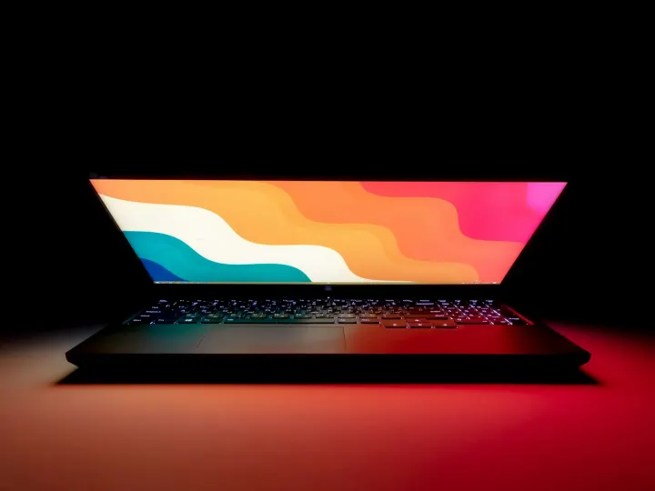 Macbook pro on black table
