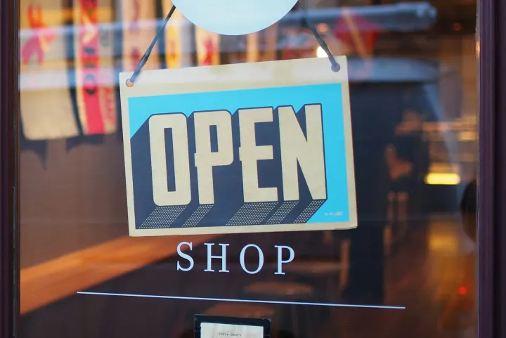 Gray and blue open signage